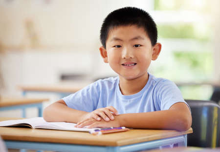 Colouring is a beneficial activity for kids of all ages. a preschooler colouring in class.