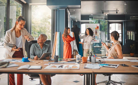 Every role contributes to the end goal. a group of female designers working in an office.の写真素材