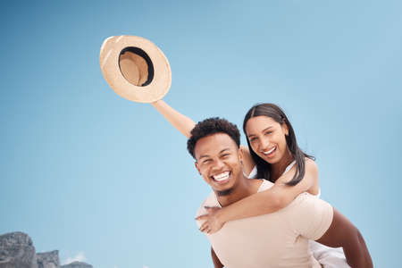 Free and light. a young couple having fun at the beach together.の写真素材