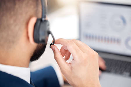 Im a good listener. an unrecognizable call center agent at work.の写真素材