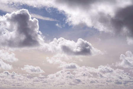 Beautiful view of cumulus clouds in a blue sky with copy space. Soft cloudscape with fluffy cloud...