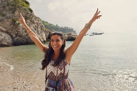 I have nothing but love for Italy. an attractive young woman standing alone and enjoying her holiday in Italy.の写真素材