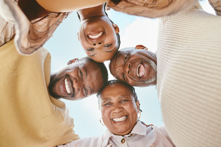The bond of family is unbreakable. a couple spending time outdoors with their parents.の写真素材