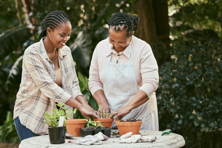 My moms got all of my heart. a mother and daughter gardening together in their backyard.の写真素材
