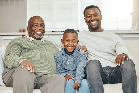 Raised with power, raised with pride. a grandparent bonding with his son and grandson on a sofa at...