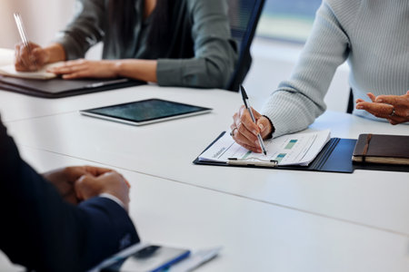 Were making the necessary plans. an unrecognizable businessperson signing a document at work.