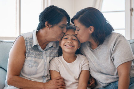 Three generations of kisses. a young woman and her mother kissing her daughter.