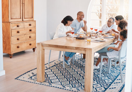 Deep belly laughs are so important. a family having lunch together.