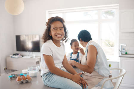 This is going to be so much fun. a mature woman baking with her granddaughters.の写真素材