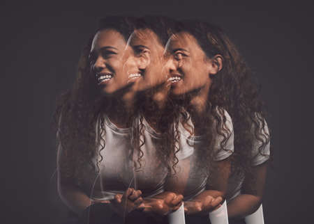 Trauma doesnt have to define you as a person. Studio shot of a young woman experiencing mental anguish and screaming against a black background.の素材 [FY310189276032]