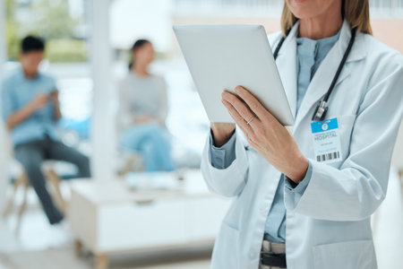an unrecognizable doctor using a digital tablet at work.の写真素材