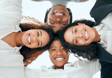 Together, we can do anything. Low angle portrait of a diverse group of young businesswomen standing...