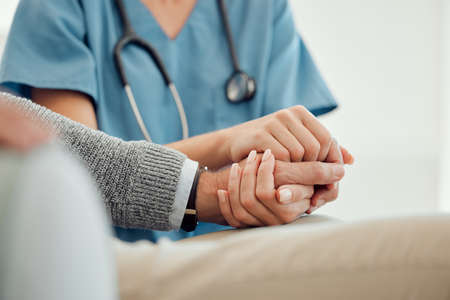 an unrecognizable doctor offering their patient support in a hard time.の写真素材