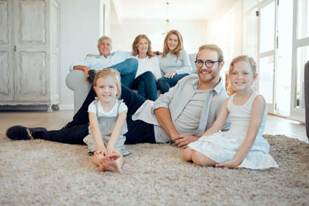Easy mornings in the full house. Portrait of a family with their grandparents bonding together at...