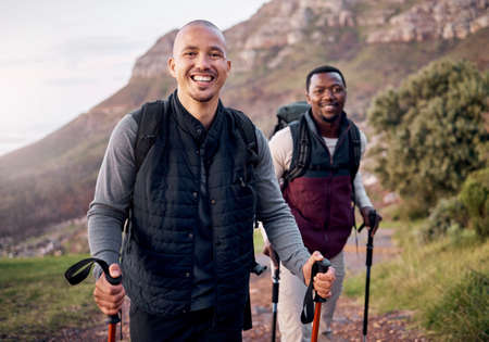 Happy hikers. Cropped portrait of two handsome young men hiking in the mountains.の写真素材