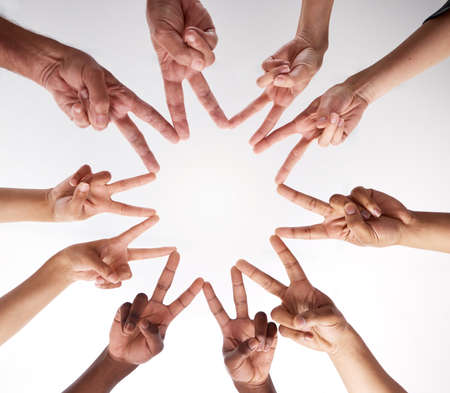 Were all part of the peace puzzle. a group of businesspeople joining hands in solidarity.