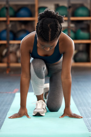 To change your life, you need to change your priorities. a sporty young woman exercising in a gym.の写真素材