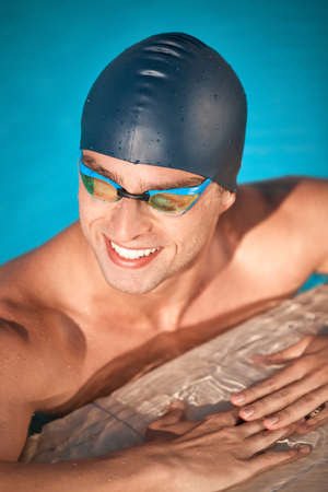 Dominating the water. a handsome young male athlete swimming in a pool.