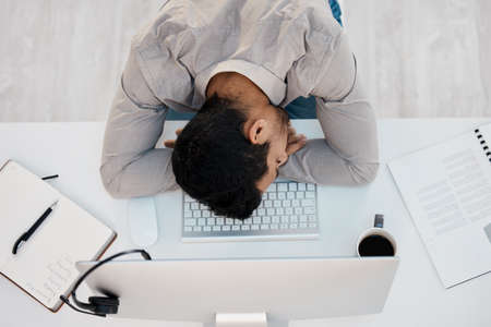 If youre on the right track, youll get run over. a young businessman sleeping in the office.