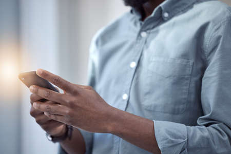There are always new people to meet. an unrecognizable businessperson using a phone at work.