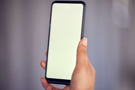 Advertising space. an unrecognizable businesswoman using her cellphone outside.