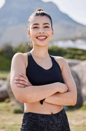Killer confidence, killer workout. Portrait of a confident young woman going for a run in the park.