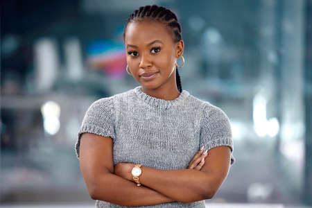 Finally time for a breather. a beautiful young businesswoman in her office.