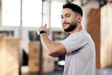 Impossible and the possible lies in a persons determination. a young man in a gym.
