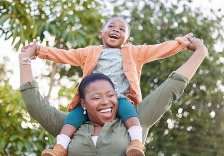 My little girl with a big personality. an adorable little girl enjoying a piggyback ride with her...