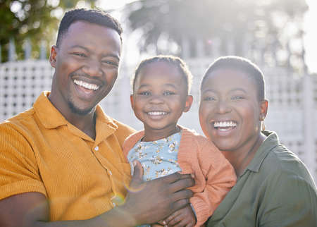 Not all wealth is measured by money. an adorable little girl having fun with her mother an father in...