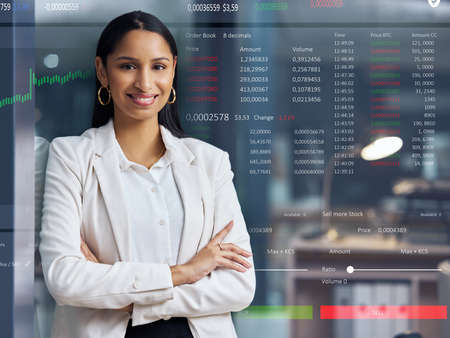Ive made a lot of money off the stock market. an attractive young businesswoman standing alone in...