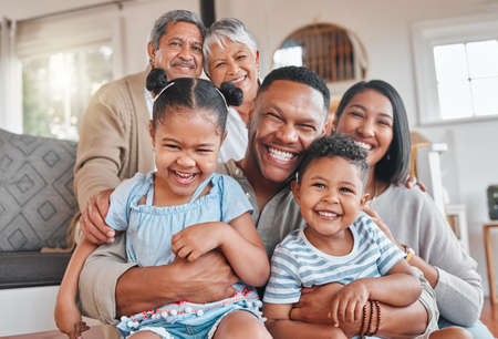 You bet were family. Portrait of a family with their grandparents bonding together on the couch at...