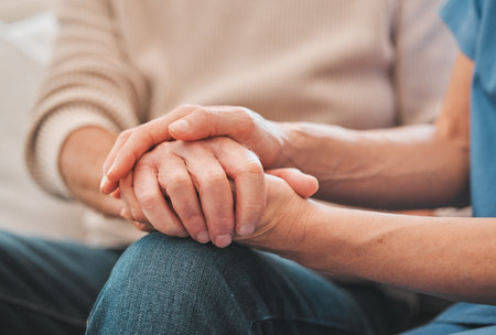 Itll be okay dont worry. a nurse offering her elderly male patient support.
