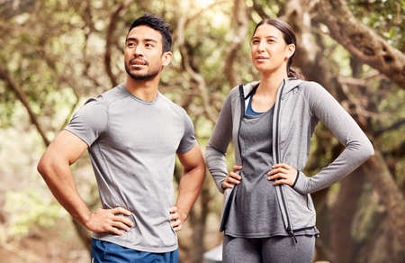 First place is for those who refused to give up. a young man and woman going for a run in nature.