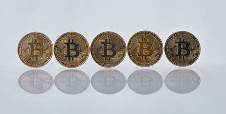 Its good to have money. Studio shot of a few coins against a grey background.の写真素材