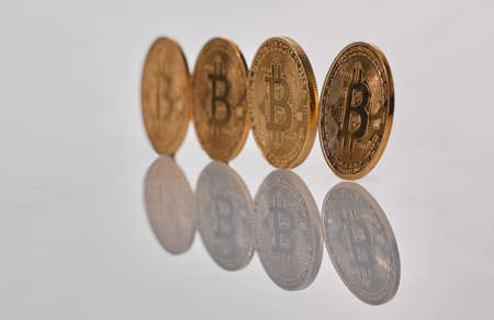 If we command our wealth, we shall be rich. Studio shot of a few coins against a grey background.の写真素材