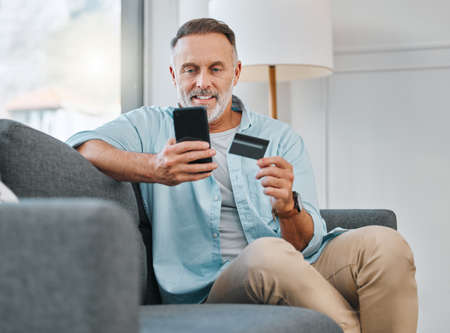 Yes, its still available. a mature man sitting alone on his sofa at home and using his cellphone for...
