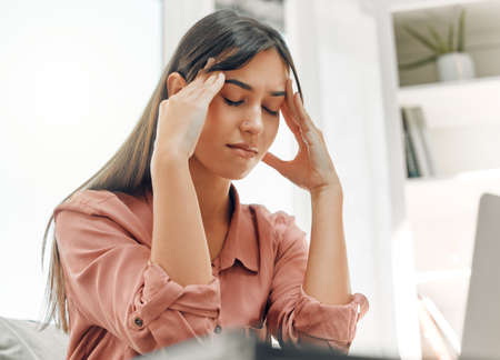 Never spend your money before you have it. a female feeling unwell at home.