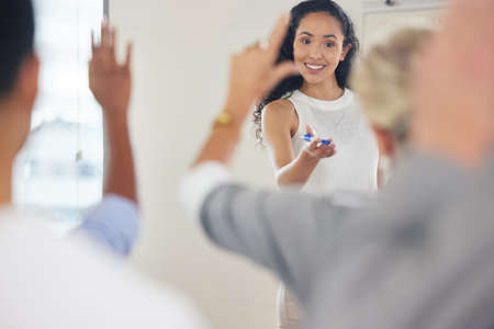 I guess it went well. a young businesswoman answering questions during a presentation.