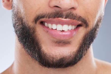 Whatever keeps you smiling, hold onto that. Cropped studio shot of an unrecognisable man smiling...