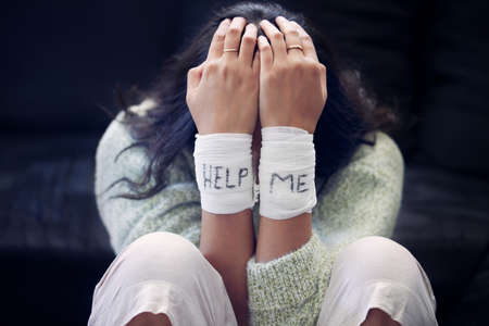 You are not the storm that rages inside you. a young woman with bandages wrapped around her wrists...
