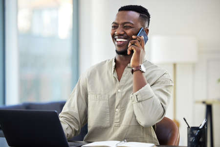 a young businessman on a call at work.