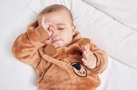 Sleep is for the weak. a baby boy rubbing his eyes in exhaustion.の写真素材