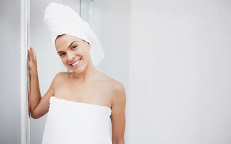 Feeling like a better version of myself. a young woman about to take a shower.の写真素材
