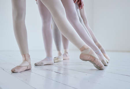 Points of purpose. a group of ballerinas with toes pointed.の写真素材