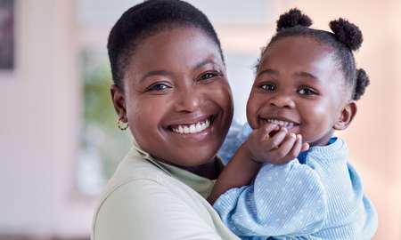 Family love is never broken. a young mother holding her daughter at home.
