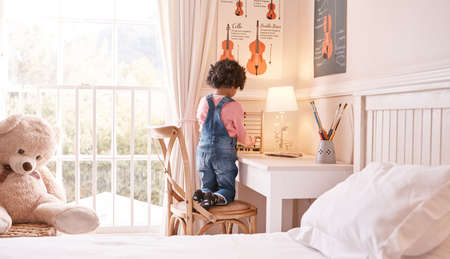 Counting made easier with the help of an abacus. a little girl using an abacus at home.の写真素材