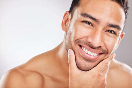 Leave the home remedies, theres a product for you. Cropped studio portrait of a handsome young man posing against a grey background.の写真素材