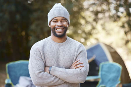 Experiencing the majesty of nature. a young man enjoying a camping trip.の写真素材