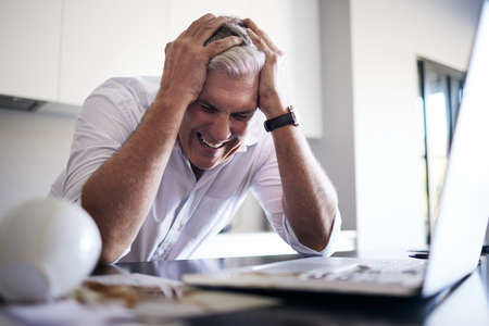 I worked hours on this. a mature man feeling stressed after spilling coffee on his paperwork and...